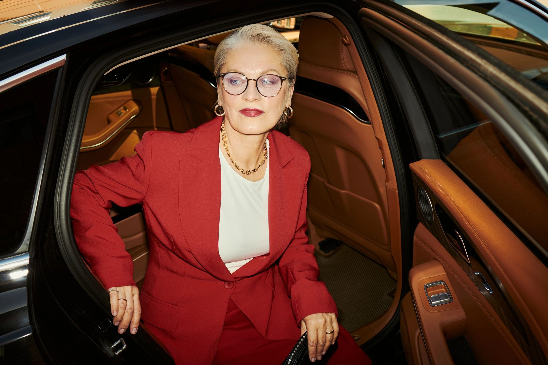 Guest exiting a luxury car for a premium transfer